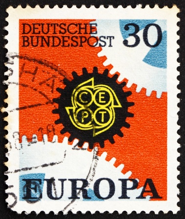 GERMANY - CIRCA 1967: a stamp printed in the Germany shows Cogwheels, Europe, circa 1967のeditorial素材