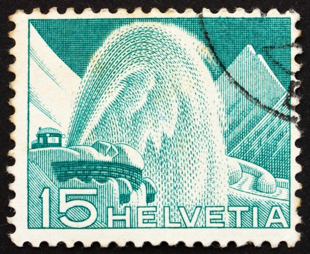 SWITZERLAND - CIRCA 1949: a stamp printed in the Switzerland shows Rotary Snow Plow, circa 1949のeditorial素材