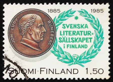 FINLAND - CIRCA 1985: a stamp printed in the Finland shows Johan Ludvig Runeberg, poet, 100th Anniversary of Society of Swedish Literature in Finland, circa 1985のeditorial素材