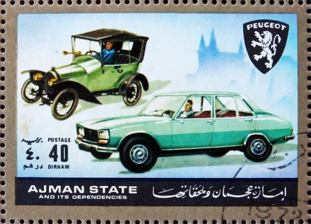 AJMAN - CIRCA 1972: a stamp printed in the Ajman shows Peugeot, Cars Then and Now, circa 1972のeditorial素材