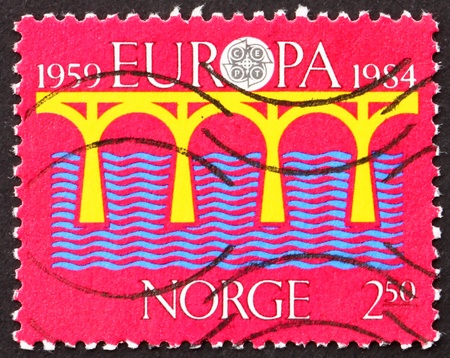 NORWAY - CIRCA 1984: a stamp printed in the Norway shows Bridge over the Sea, Europe, circa 1984のeditorial素材