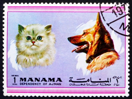 MANAMA - CIRCA 1972: a stamp printed in the Manama shows Dog and Cat, Pets, circa 1972のeditorial素材