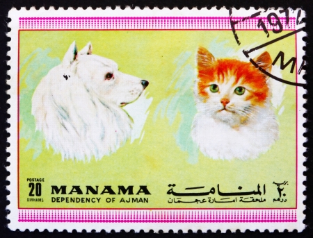 MANAMA - CIRCA 1972: a stamp printed in the Manama shows Dog and Cat, Pets, circa 1972のeditorial素材