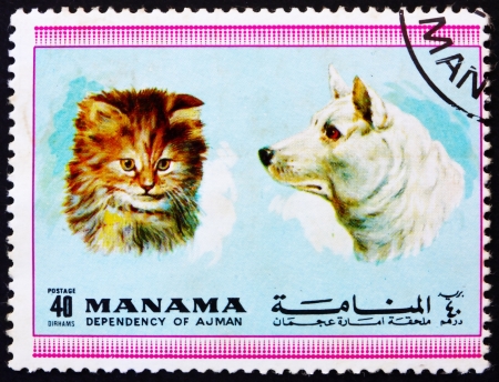 MANAMA - CIRCA 1972: a stamp printed in the Manama shows Dog and Cat, Pets, circa 1972のeditorial素材