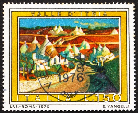 ITALY - CIRCA 1976: a stamp printed in the Italy shows Itria Valley, Apulia, Italy, circa 1976のeditorial素材