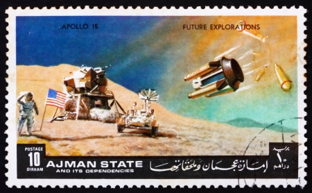 AJMAN - CIRCA 1972: a stamp printed in the Ajman shows Moon-landing, Apollo 15, Mission to the Moon, circa 1972のeditorial素材