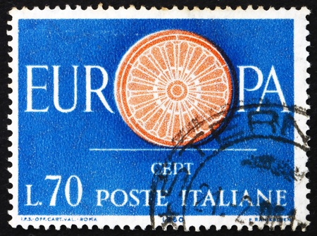 ITALY - CIRCA 1960: a stamp printed in the Italy shows 19-Spoke wheel, First Anniversary of the CEPT, 19 Founding Members of the Conference, European Integration, circa 1960のeditorial素材