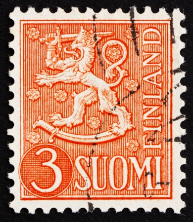 FINLAND - CIRCA 1954: a stamp printed in the Finland shows Crowned Lion Rampant, Arms of the Republic of Finland, circa 1954のeditorial素材