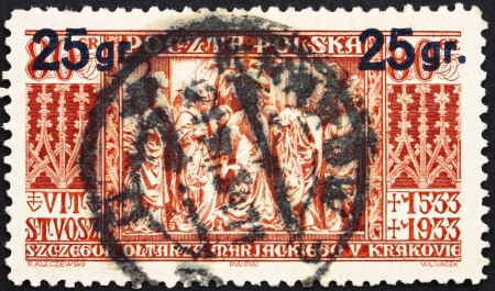 POLAND - CIRCA 1934: a stamp printed in the Poland shows Altar Panel of St. Mary's Church, Cracow, 400th Death Anniversary of Veit Stoss, Sculptor and Woodcarver, circa 1934のeditorial素材