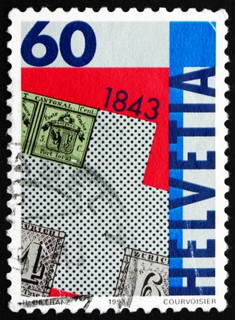 SWITZERLAND - CIRCA 1993: a stamp printed in the Switzerland shows Postage Stamp Zurich Types A1 and A2, 150th Anniversary of First Swiss Postage Stamps, circa 1993のeditorial素材