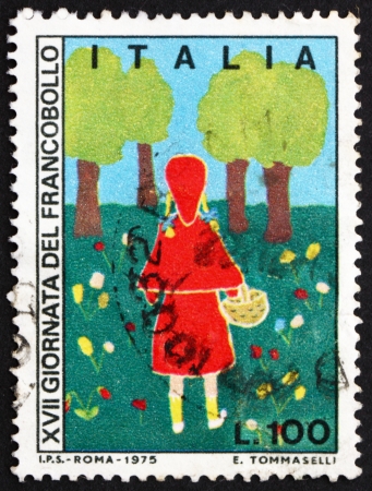 ITALY - CIRCA 1975: a stamp printed in the Italy shows The Magic Orchard, Children's Drawing, circa 1975のeditorial素材