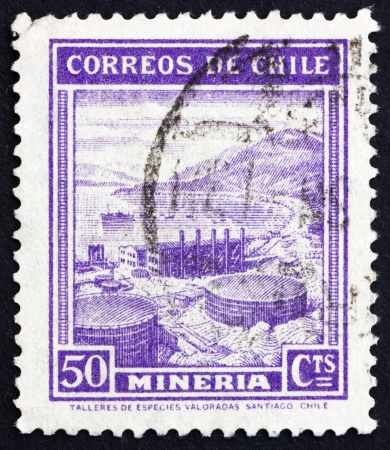 CHILE - CIRCA 1938: a stamp printed in the Chile shows Mining, Industry, circa 1938のeditorial素材