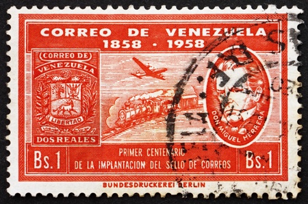VENEZUELA - CIRCA 1959: a stamp printed in the Venezuela shows Plane, Train and Don Miguel Herrera, Centenary of Venezuelan Postage Stamps, circa 1959のeditorial素材