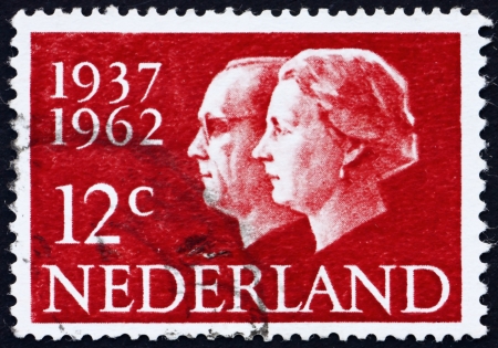 NETHERLANDS - CIRCA 1962: a stamp printed in the Netherlands shows Queen Juliana and Prince Bernhard, Silver Wedding Anniversary, circa 1962のeditorial素材