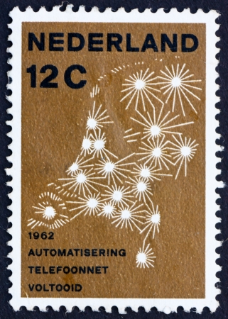 NETHERLANDS - CIRCA 1962: a stamp printed in the Netherlands shows Map Showing Telephone Network, Completion of the Automation of the Netherlands Telephone Network, circa 1962のeditorial素材