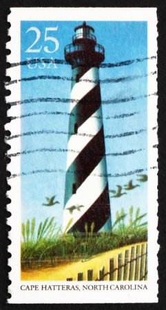 UNITED STATES OF AMERICA - CIRCA 1990: a stamp printed in the USA shows Cape Hatteras, North Carolina, Lighthouse, circa 1990のeditorial素材