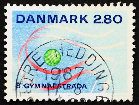 DENMARK - CIRCA 1987: a stamp printed in the Denmark shows 8th Gymnaestrada, Herning, circa 1987のeditorial素材