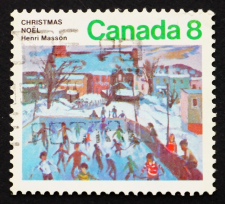 CANADA - CIRCA 1974: a stamp printed in the Canada shows Skaters at Hull, Painting by Henri Masson, Christmas, circa 1974のeditorial素材