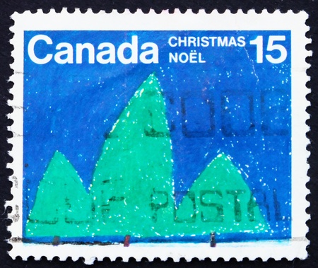 CANADA - CIRCA 1975: a stamp printed in the Canada shows Trees, Christmas, Childrens Picture, circa 1975のeditorial素材