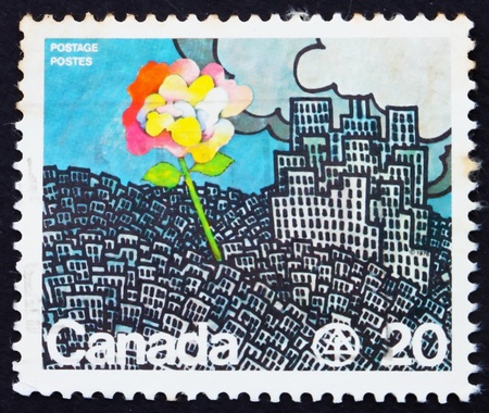 CANADA - CIRCA 1976: a stamp printed in the Canada shows Flower Growing from City, UN Conference on Human Settlements, Vancouver, circa 1976のeditorial素材