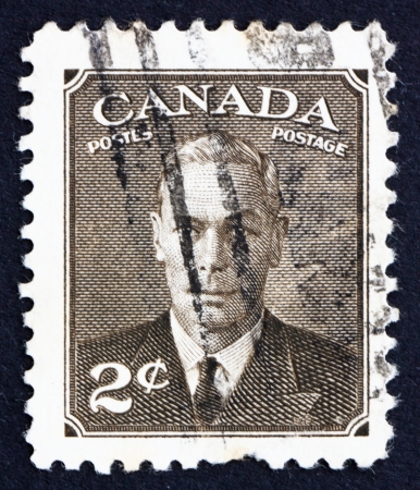 CANADA - CIRCA 1949 a stamp printed in the Canada shows King George VI, King of England, circa 1949のeditorial素材