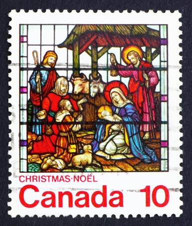 CANADA - CIRCA 1976: a stamp printed in the Canada shows Nativity, Stained-glass Window, St. Jude, London, Ontario, circa 1976のeditorial素材