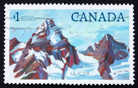CANADA - CIRCA 1994: a stamp printed in the Canada shows High Mountain, circa 1994のeditorial素材