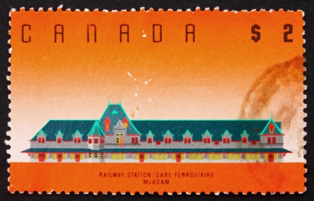 CANADA - CIRCA 1989: a stamp printed in the Canada shows McAdam Railway Station, New Brunswick, circa 1989のeditorial素材