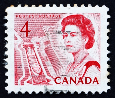 CANADA - CIRCA 1967: a stamp printed in the Canada shows Ship in Lock, Central Canada, Queen Elizabeth II, circa 1967のeditorial素材