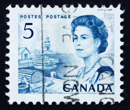 CANADA - CIRCA 1967: a stamp printed in the Canada shows Lobster Traps and Boat, Atlantic Provinces, Queen Elizabeth II, circa 1967のeditorial素材