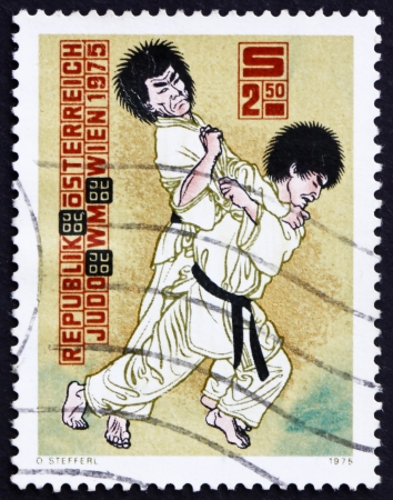 AUSTRIA - CIRCA 1975: a stamp printed in the Austria shows Judo Throw, 10th World Judo Championships, Vienna, circa 1975のeditorial素材