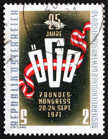 AUSTRIA - CIRCA 1971: a stamp printed in the Austria shows Trade Union Emblem, 25th Anniversary of Austrian Trade Union Association, circa 1971のeditorial素材