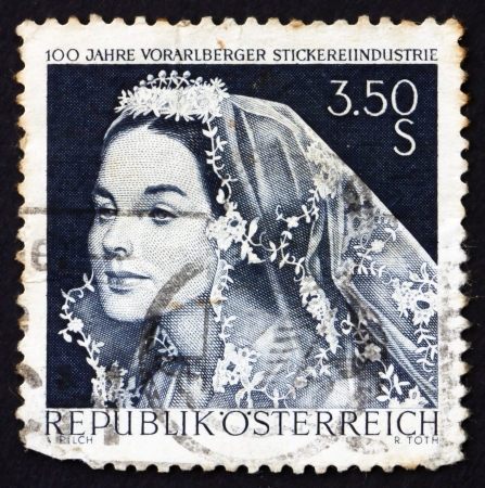 AUSTRIA - CIRCA 1968: a stamp printed in the Austria shows Bride with Lace Veil, Centenary of Embroidery Industry of Vorarlberg, circa 1968のeditorial素材