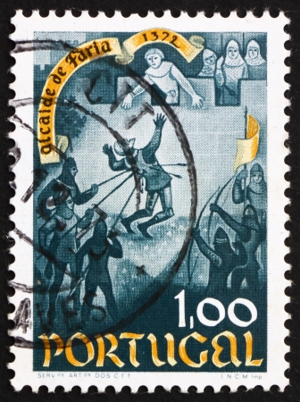PORTUGAL - CIRCA 1972: a stamp printed in the Portugal shows Death of Nuno Gonzalves, 600th Anniversary of the Heroism of Nuno Gonzalves, Alcaide od Faria Castle, circa 1972のeditorial素材
