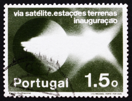 PORTUGAL - CIRCA 1974: a stamp printed in the Portugal shows Pattern of Light Emission, Establishment of Satellite Communications Network, circa 1974のeditorial素材