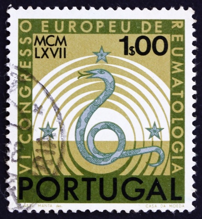 PORTUGAL - CIRCA 1967: a stamp printed in the Portugal shows Symbols of Healing, 6th European Congress of Rheumatology, Lisbon, circa 1967のeditorial素材