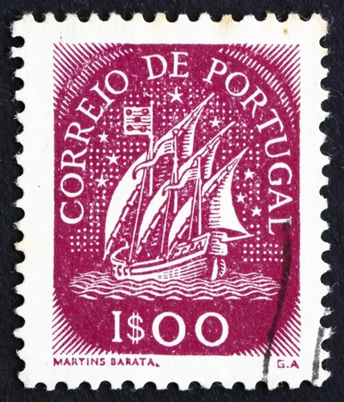 PORTUGAL - CIRCA 1943: a stamp printed in the Portugal shows Ancient Sailing Vessel, circa 1943のeditorial素材