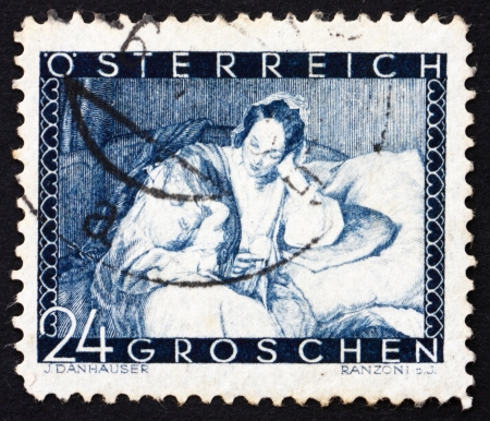 AUSTRIA - CIRCA 1935: a stamp printed in the Austria shows Mother and Child, by Joseph Danhauser, Mothers Day, circa 1935のeditorial素材