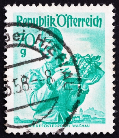 AUSTRIA - CIRCA 1949: a stamp printed in the Austria shows Woman from Lower Austria, Wachau, Regional Costume, circa 1949のeditorial素材