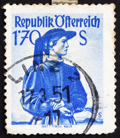 AUSTRIA - CIRCA 1950: a stamp printed in the Austria shows Woman from East Tyrol, Kals, Regional Costume, circa 1950のeditorial素材
