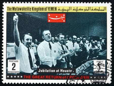 YEMEN - CIRCA 1969: a stamp printed in the Yemen shows Jubilation at Houston, Return of Apollo XIII, circa 1969のeditorial素材