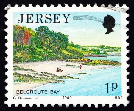 JERSEY - CIRCA 1989: a stamp printed in the Jersey shows Belcroute Bay, Scenic View, circa 1989のeditorial素材
