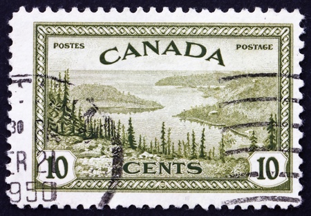 CANADA - CIRCA 1946: a stamp printed in the Canada shows Great Bear Lake, Mackenzie, circa 1946のeditorial素材