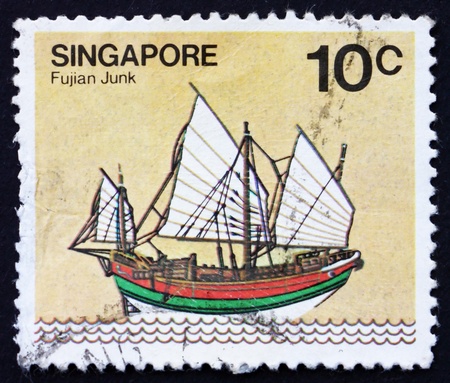 SINGAPORE - CIRCA 1980: a stamp printed in the Singapore shows Fujian Junk, Sailing Ship, circa 1980のeditorial素材