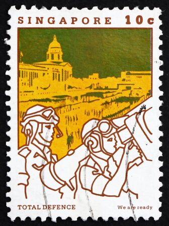 SINGAPORE - CIRCA 1984: a stamp printed in the Singapore shows Total Defense, We Are ready, 25th Anniversary of Self-government, circa 1984のeditorial素材
