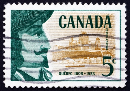 CANADA - CIRCA 1958: a stamp printed in the Canada shows Samuel de Champlain and View of Quebec, 350th Anniversary of Founding of Quebec, circa 1958のeditorial素材