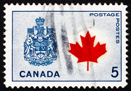 CANADA - CIRCA 1966: a stamp printed in the Canada shows Maple Leaf and Arms of Canada, circa 1966