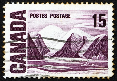 CANADA - CIRCA 1967: a stamp printed in the Canada shows Bylot Island, Oil Painting by Lawren Harris, circa 1967のeditorial素材