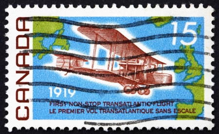 CANADA - CIRCA 1969: a stamp printed in the Canada shows Vickers Vimy, 1919, and Map of the Atlantic, 50th Anniversary of the first non-stop Flight from Newfoundland to Ireland, circa 1969のeditorial素材