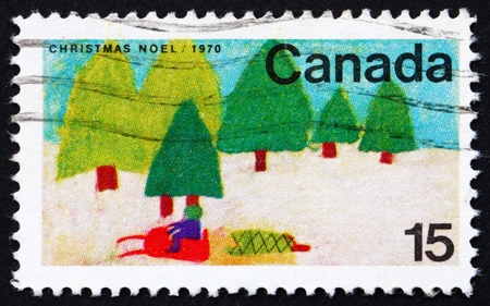CANADA - CIRCA 1970: a stamp printed in the Canada shows Snowmobile and Trees, Design by Canadian School Children, Christmas, circa 1970のeditorial素材